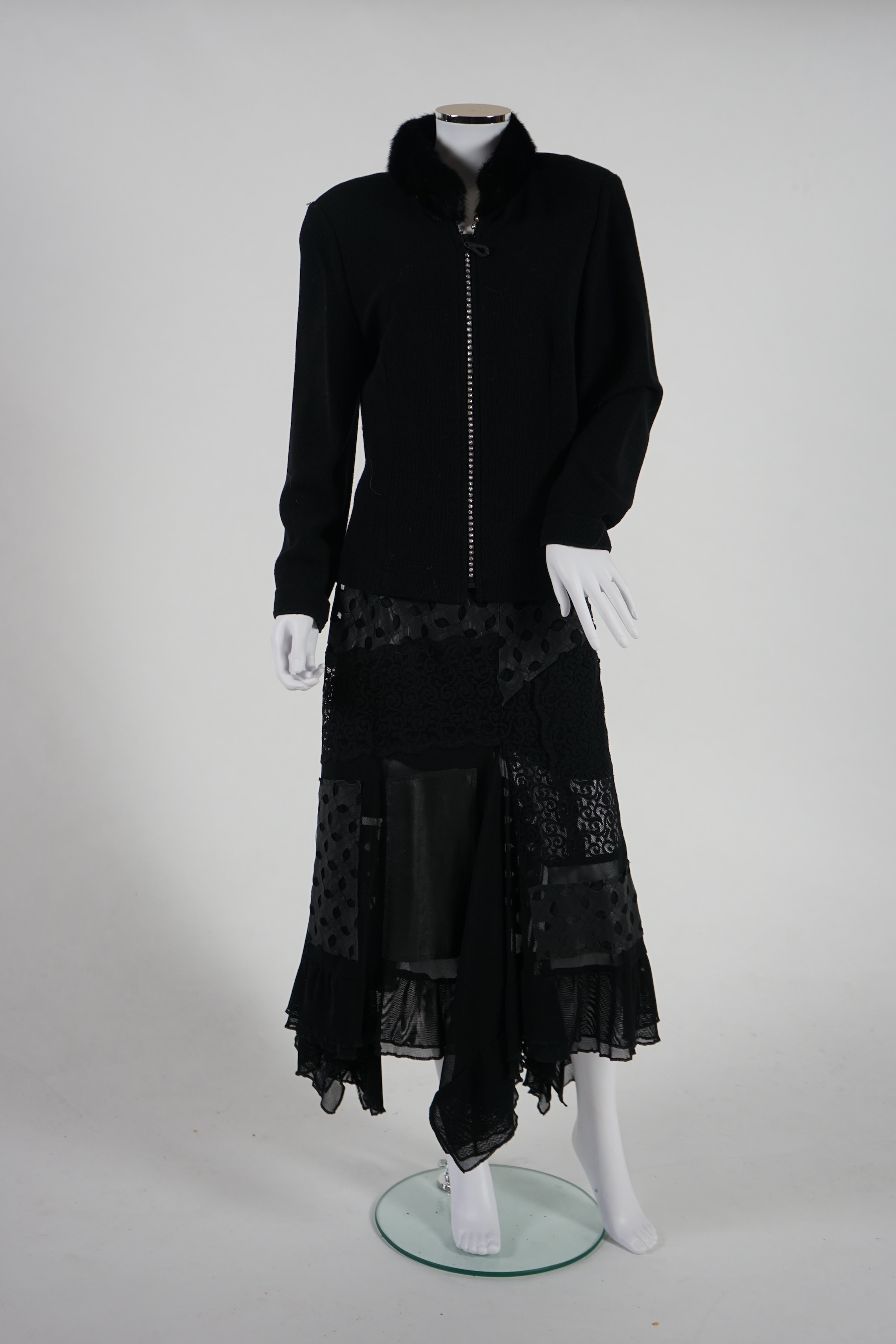 A Gloria Estelles black lady's knitted jacket with fur collar and diamonté detail and an Azur black leather and lace midi skirt. Size 16. Proceeds to Happy Paws Puppy Rescue